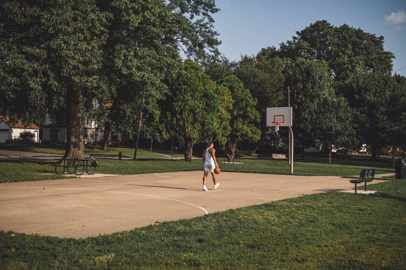 Da'Von Manuel on an outdoor basketball court, ball in hand